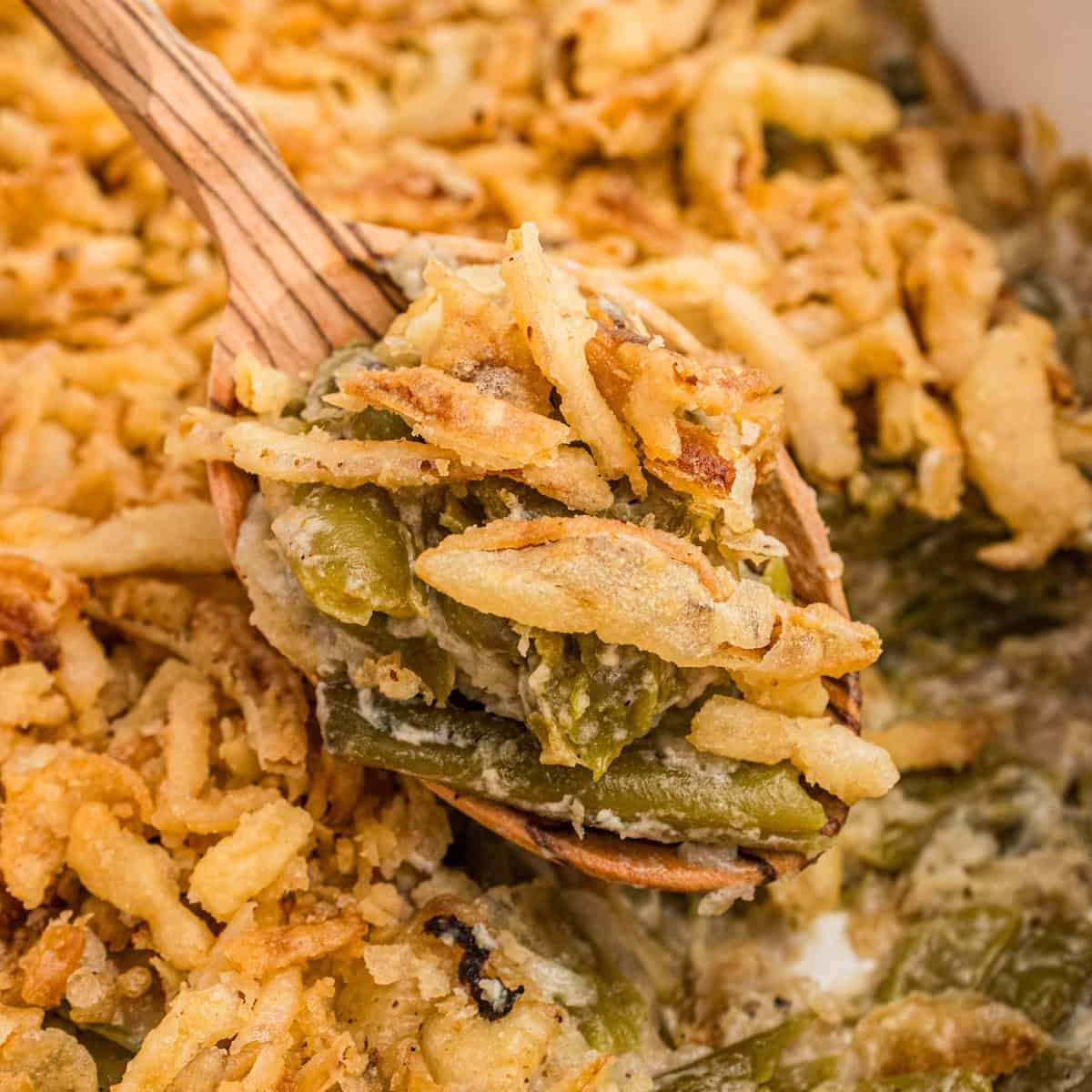 Classic green bean casserole with a creamy mushroom sauce and a generous layer of crispy fried onions